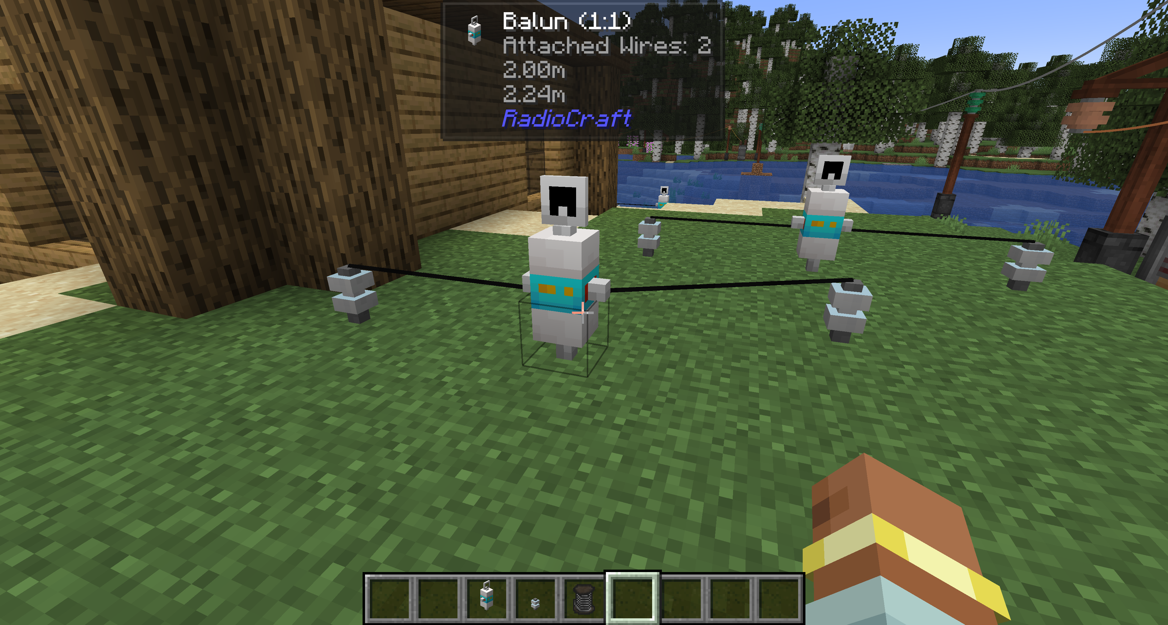 Balun 1:1 block in Minecraft with two attached antenna wires and ceramic insulators